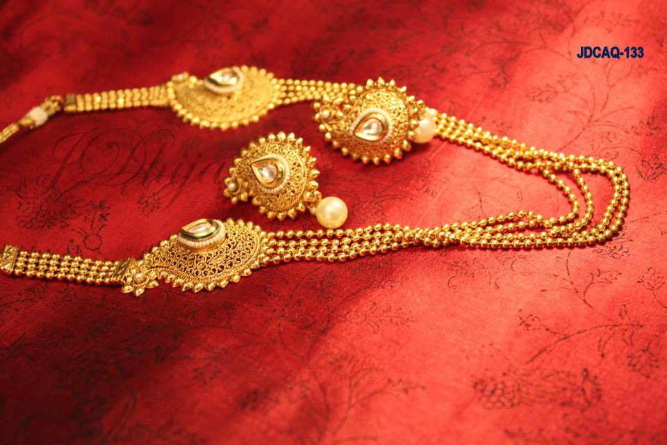 Multi layered chain with Paan shaped design and earrings