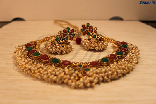 Clustered pearls with green/red stone embedded necklace set Tikka